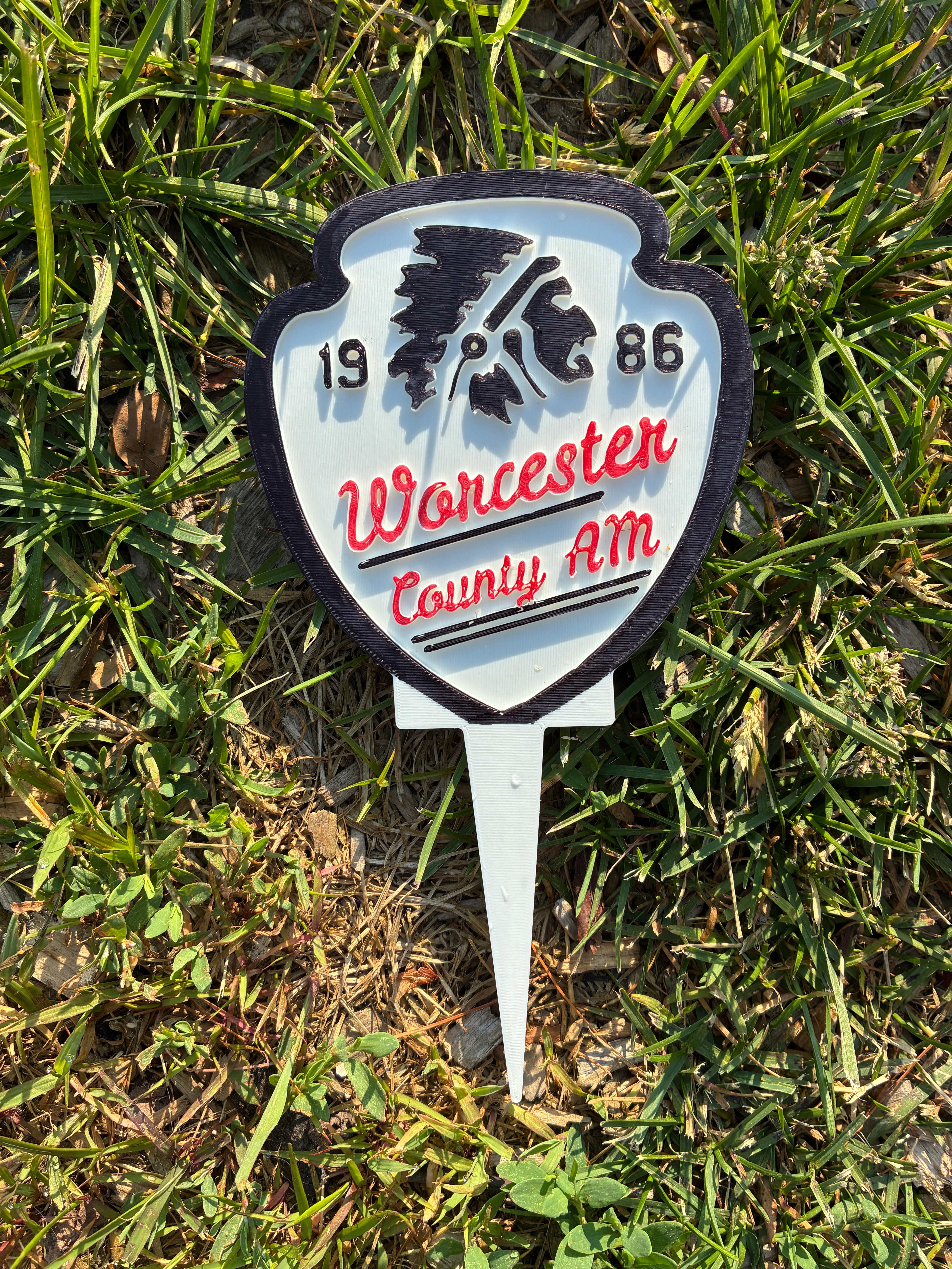 Worcester County AM 1986 shield-shaped tournament tee sign with custom client design for charity golf events